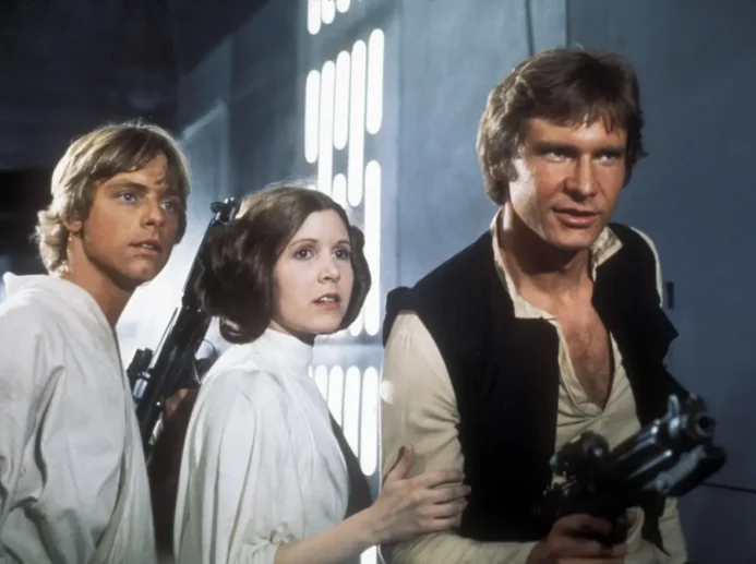 Mark Hamill jako Luke, Carrie Fisher jako Leia a Harrison Ford jako Han Solo.